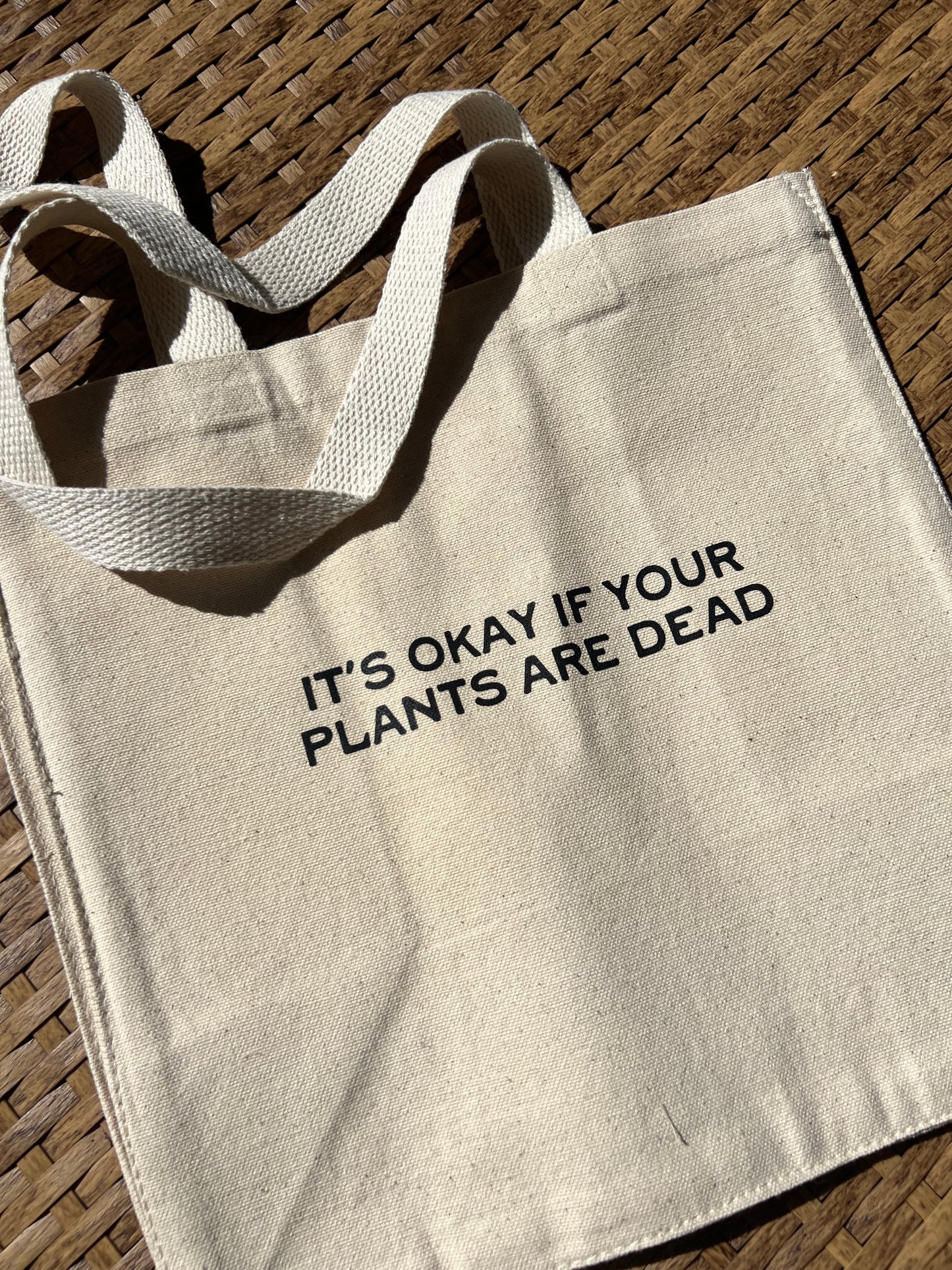 “It’s okay if your plants are dead” tote bag